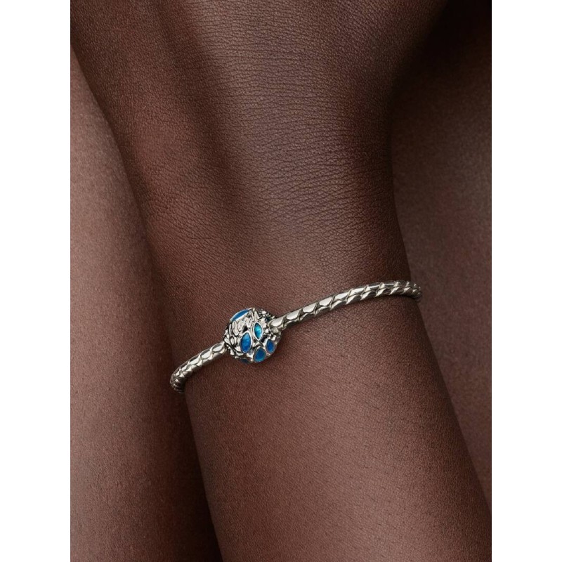 Openwork fish sterling silver charm with transparent blue enamel